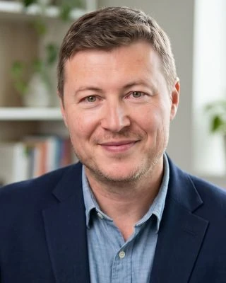 Markus Pantea, Registered Psychotherapist (Qualifying), in a bright consulting room